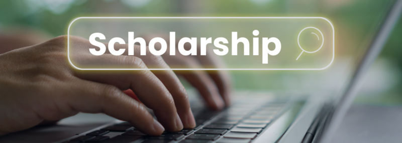 graphic of person typing on a computer searching for scholarships