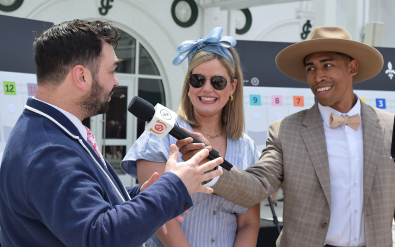 Man interviewing Churchill Downs staff during the 2025 Winsday event.