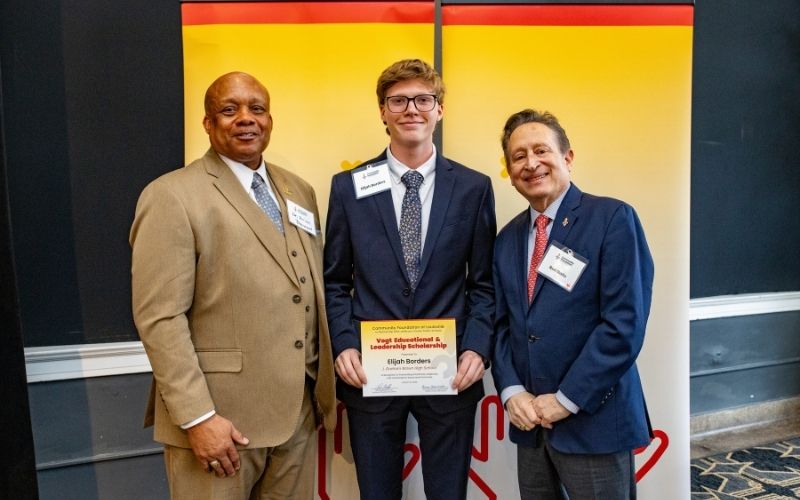 Photo featuring JCPS Superintendent Brian Yearwood, Ph.D., Vogt Scholar, Vogt Scholar Elijah Borders, and Community Foundation CEO & President, Ron Gallo