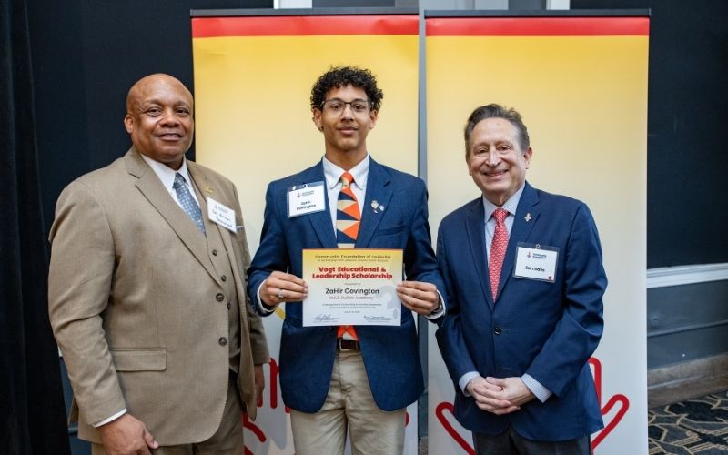 Photo featuring JCPS Superintendent Brian Yearwood, Ph.D., Vogt Scholar, Vogt Scholar ZaHir Covington, and Community Foundation CEO & President, Ron Gallo
