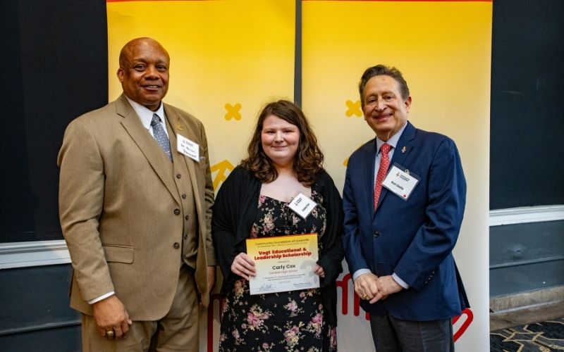 Photo featuring JCPS Superintendent Brian Yearwood, Ph.D., Vogt Scholar, Vogt Scholar Carly Cox, and Community Foundation CEO & President, Ron Gallo