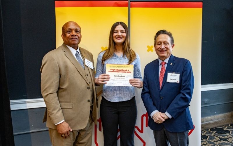 Photo featuring JCPS Superintendent Brian Yearwood, Ph.D., Vogt Scholar Izzy Probus, and Community Foundation CEO & President, Ron Gallo